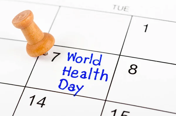 Handwriting Reminder World Health Day in calendar with wooden pin. April 07.