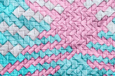 Arka plan olarak suni deri örgü dokusuna renkli soyut.