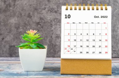 October 2022 Monthly desk calendar for 2022 year with plant pot.