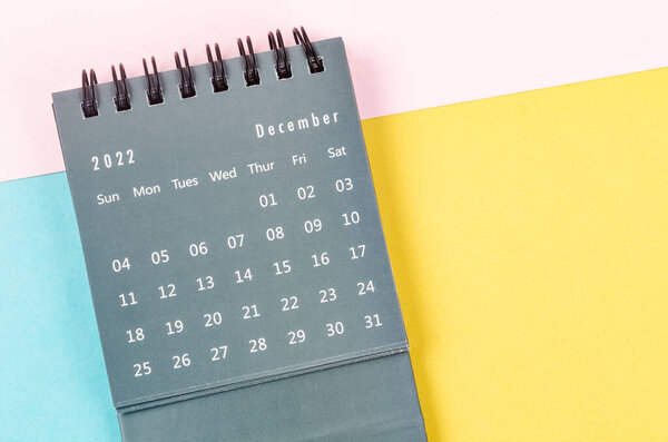 December 2022 Monthly desk calendar for 2022 year on beautiful background.