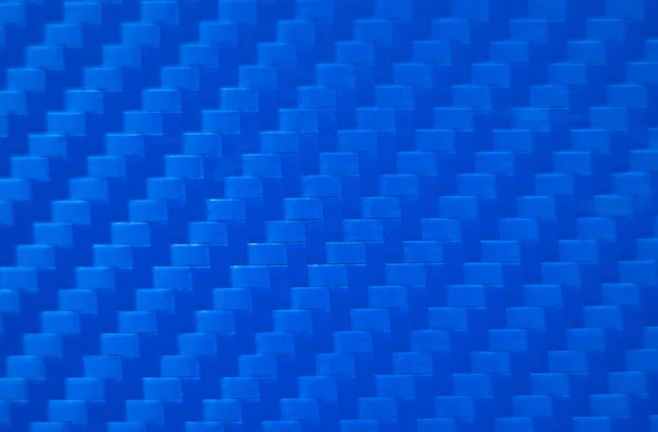 Foto da textura azul de fibra de carbono. Filme de vinil azul para colar carros esportivos. Estilo de corrida. Desportivo fundo azul. — Fotografia de Stock