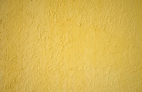 Photo of the texture of a yellow concrete wall. Yellow background for text. — Stockfoto