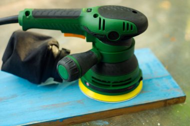 Electric wood sander. A builders hand tool.