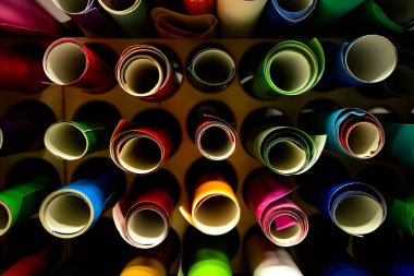 Round rolls with film of different colors for car tuning.
