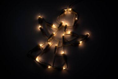 Angel figurine with yellow light bulbs photo
