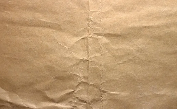 Photo of the texture of an old sheet of paper folded in half. — Stok fotoğraf