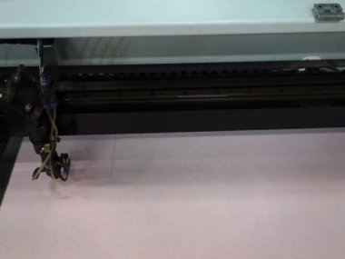 Laser machine, cuts out square details from felt textiles. Production of designer clothing.