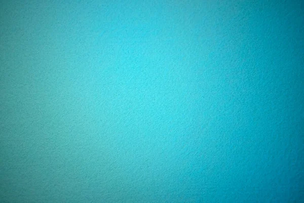 Yumuşak mukavvanın mavi dokusu. Temiz mavi arkaplan. Tebrik mesajı için temiz bir yer. Kaliteli fotoğraf.