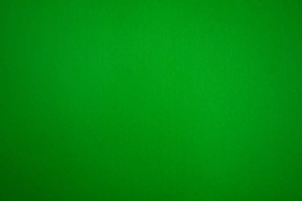 Photo of the texture of a green background made of felt fabric. Green stuff. — Stock Photo, Image