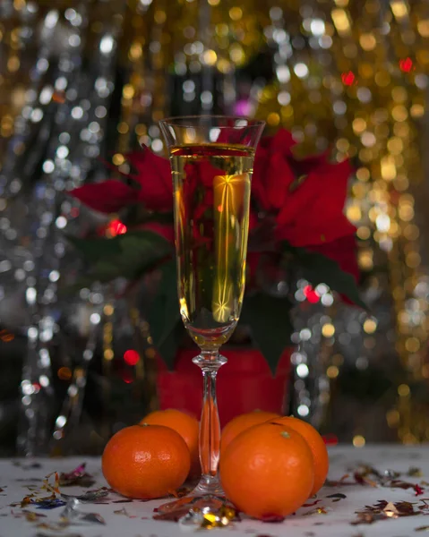 Glass Champagne Christmas Decorations Tangerines Poinsettia — Zdjęcie stockowe