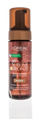 Winneconne, WI - 23 July 2022: A package of Loreal Paris sublime bronze self tanning water mousse on an isolated background.