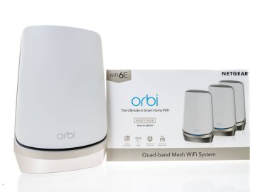 Winneconne, WI - 20 August 2022:  A Package of Netgear Orbi AXE11000 RBKE963 the ulitmate in smart home WIFI quad band mesh wifi system on an isolated background.