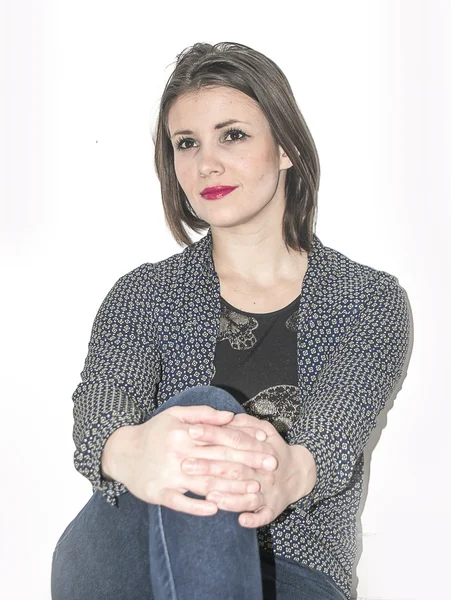 Young woman sitting and thinking — Stock Photo, Image