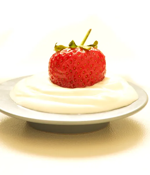 Strawberry in a cream — Stock Photo, Image
