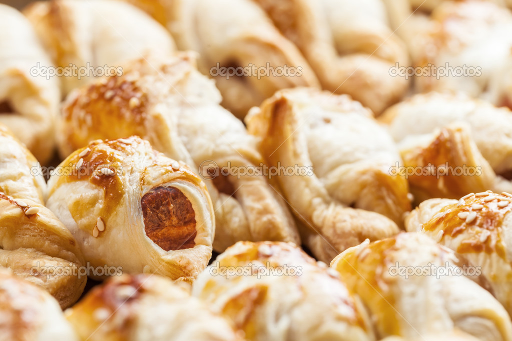 Closeup of freshly baked frankfurter sausages battered in puffed