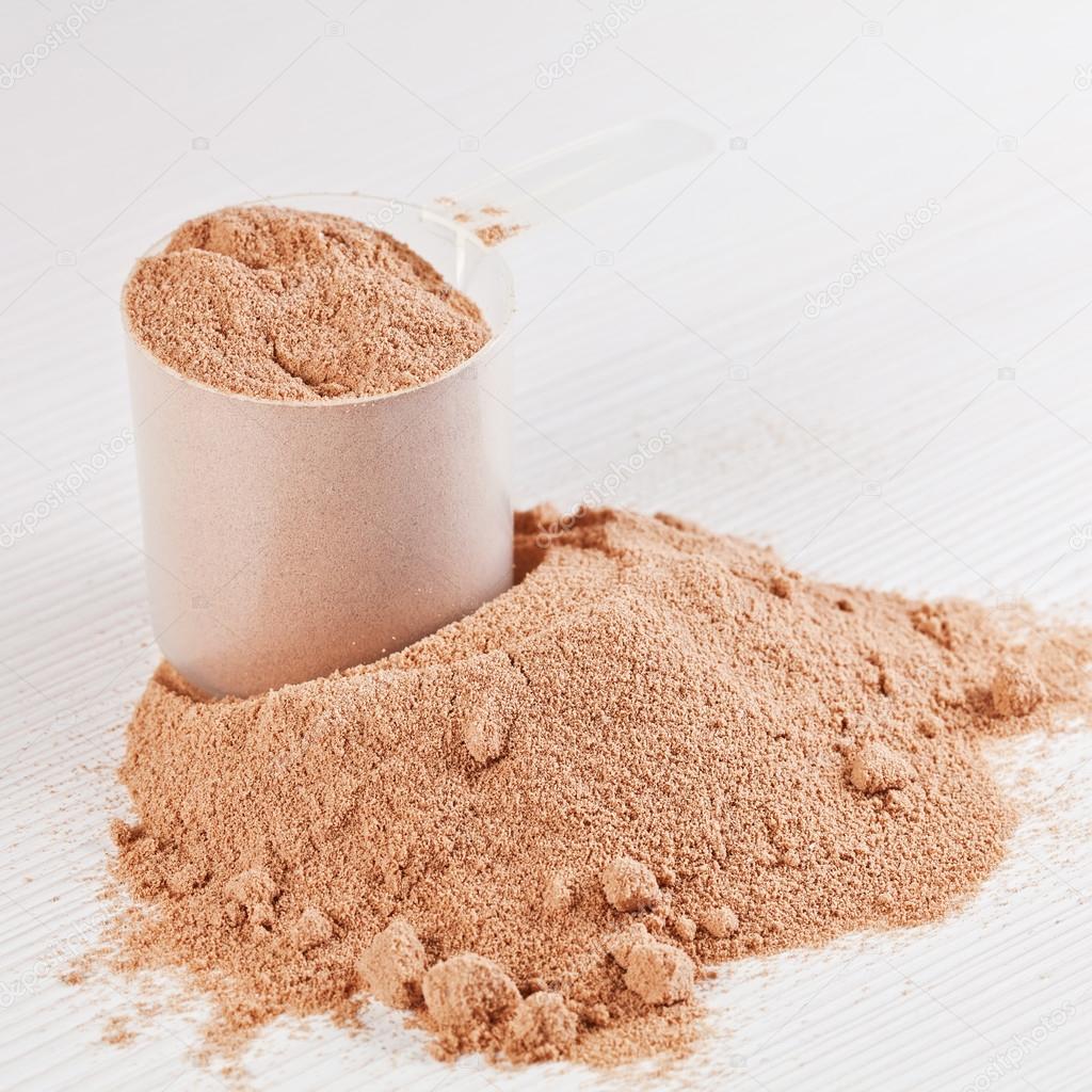 Scoop of chocolate whey isolate protein powder or weight loss po Stock  Photo by ©deymosd 38796899