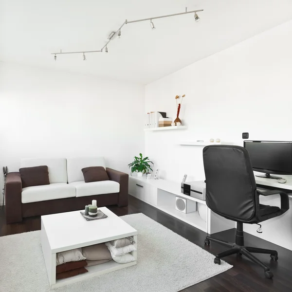 Modern living room with computer desk and the screen, sofa and t — Stock Photo, Image