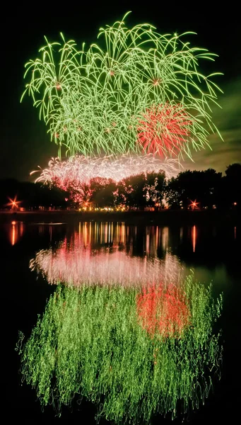 Huge fireworks with reflection on the water — Stock Photo, Image