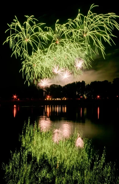 Huge fireworks with reflection on the water — Stock Photo, Image