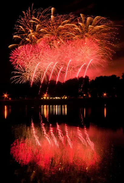 Huge fireworks with reflection on the water — Stock Photo, Image