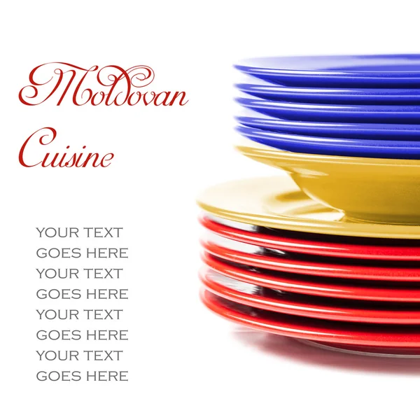 Stack of colorful ceramics plates in Moldovan colors — Stock Photo, Image