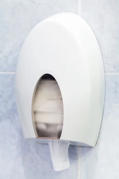 Toilet paper holder mounted on the bathroom wall — Stock Photo, Image