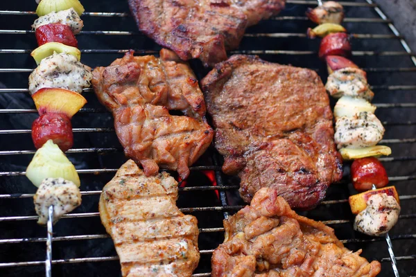 Meat and skewers on the grill — Stock Photo, Image