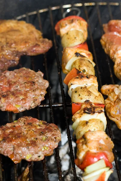 Meat and skewers on the grill — Stock Photo, Image