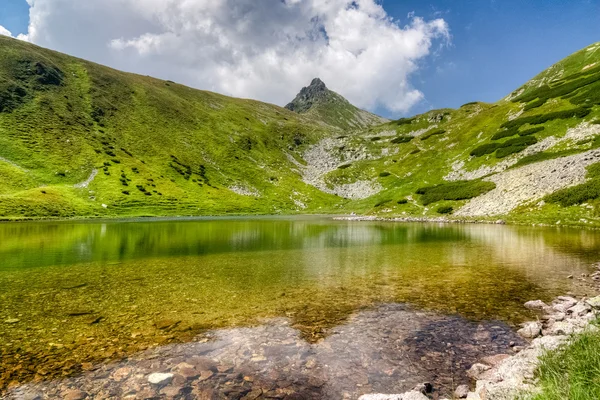 Amazing mountain lake and stony peak — Stok Foto