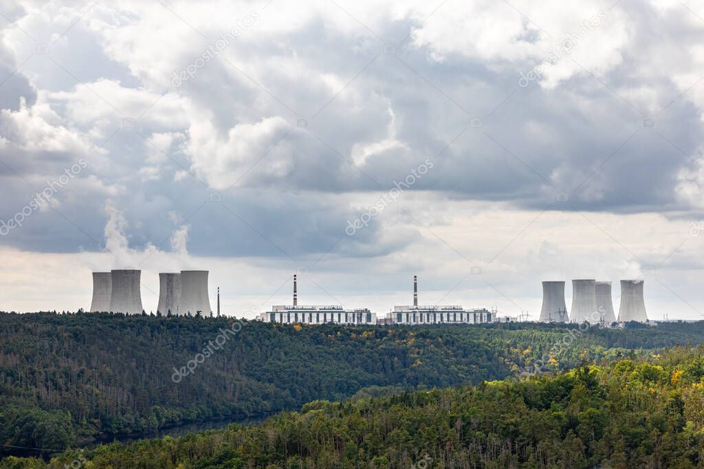 Forest and nuclear power plant under cloudy sky - near Dukovany village, Czech Republic, Europe
