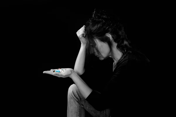 Woman Contemplating Suicide Drugs Hand Dark Imágenes de stock libres de derechos