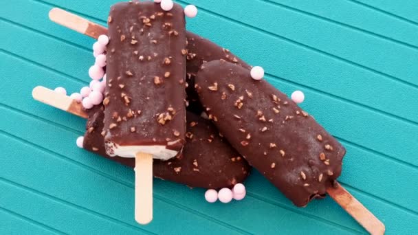Ice Creams Sticks Pink Candies Rotating Blue Background — Videoclip de stoc