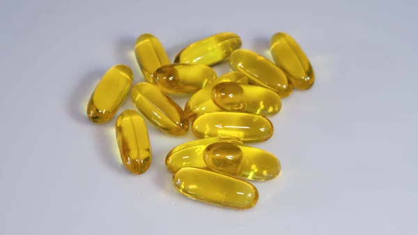 vitamin E capsules on white background