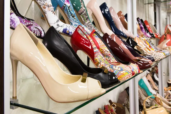 Rows of beautiful women's shoes on store shelves — Stock Image Rows of beautiful women's shoes on store shelves Stock Image