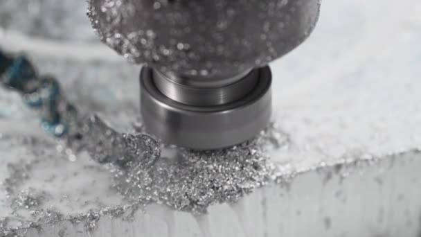 The CNC drill bit drills a hole in a flood aliminium shape in circular motion — Vídeo de Stock