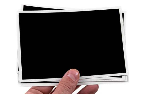 Empty photo frames held in the hand on white background — Stock Photo, Image