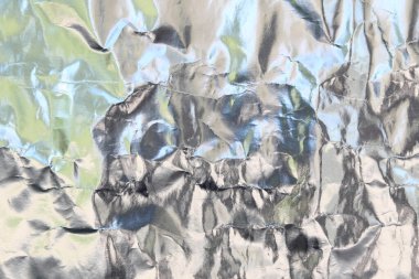 Arka plan için parlak yüzeyi olan gümüş folyo