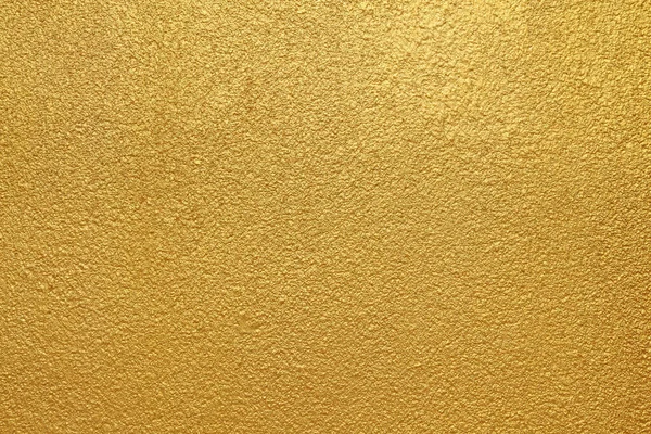 Beton duvara altın arka plan dokusu.