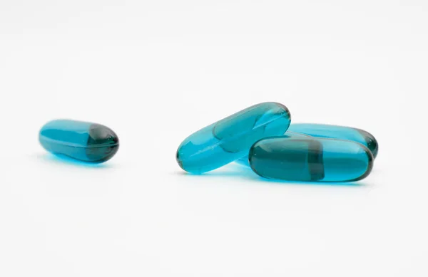 Blue Transparent Supplement Capsule Isolated White Background — 图库照片