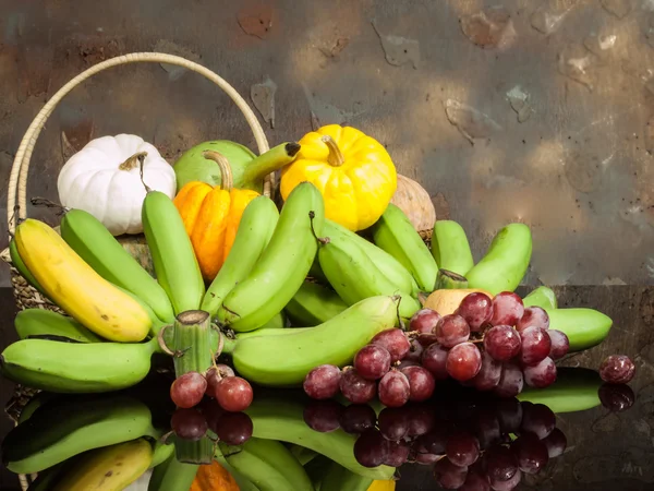 Pumpkins and banana and grape — Stock Photo, Image