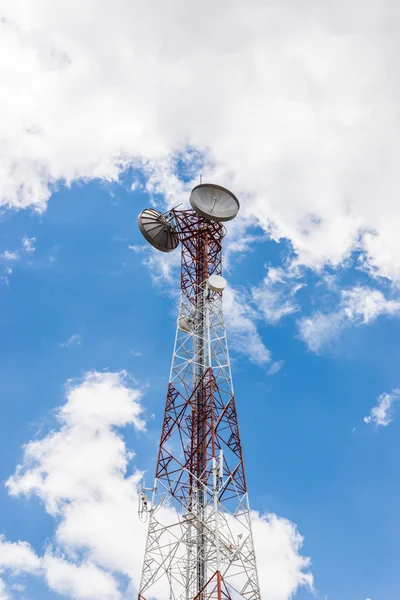Red and white tower of communications with a lot of different an — Stock Photo, Image