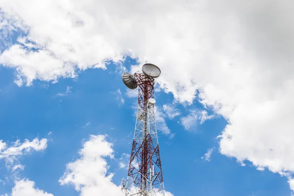 Red and white tower of communications with a lot of different an — Stock Photo, Image