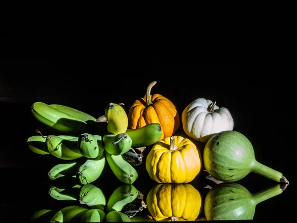 Still life lightpaint color-full little pumpkins and banana — Stock Photo, Image