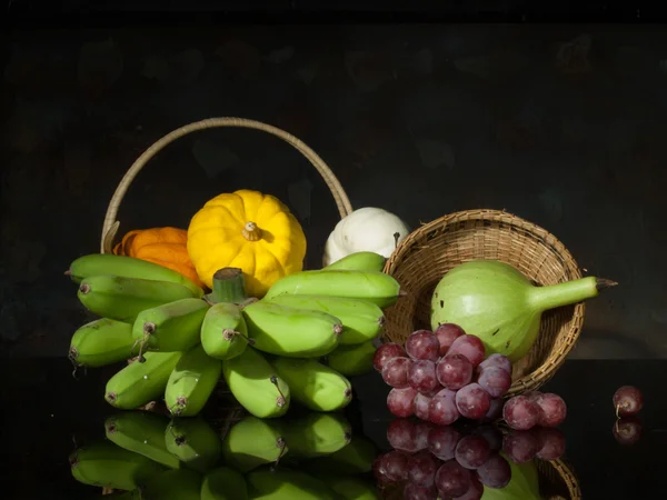 Pumpkins and banana and grape — Stock Photo, Image