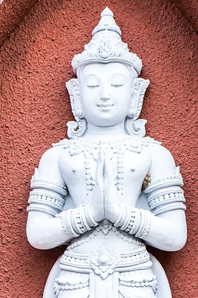 Statuetta in porcellana bianca di Buddha seduto meditante — Foto Stock
