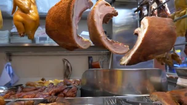 Meat displayed at the counter at the food market in Hong Kong, China — стоковое видео