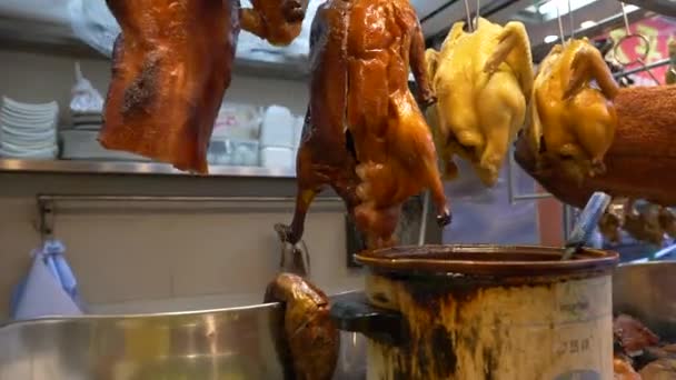 Various meats displayed at the counter at the food market in Hong Kong city center, China — стоковое видео