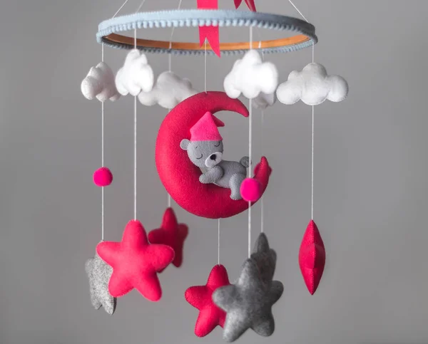 Baby cot mobile, musical toy hang over the crib. Dreamy bear in the moon, space-themed baby cot mobile.