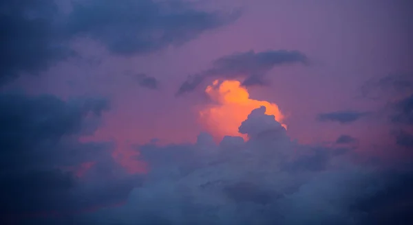 Bright Orange Cloud Peeks Out Dark Heavy Rain Clouds — Photo