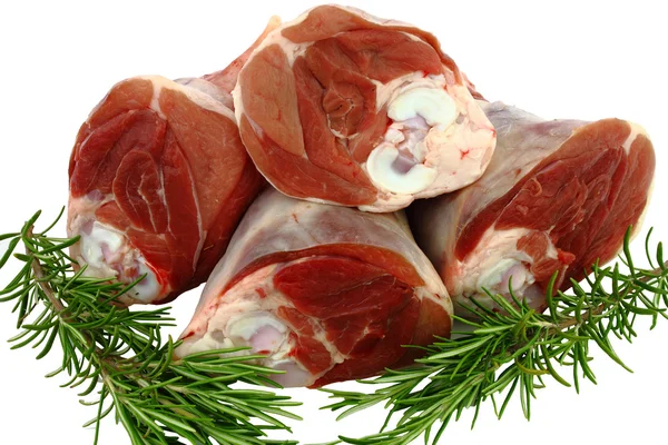 Raw lamb shanks with sprigs of Rosemary — Stock Photo, Image
